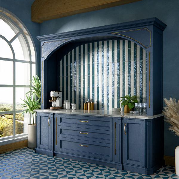 Kitchen interior featuring Allegra gloss brick tiles in mixed blue and white tones, installed vertically within a statement alcove, styled with navy cabinetry, brass accents, and a marble surface in a classic yet contemporary setting.