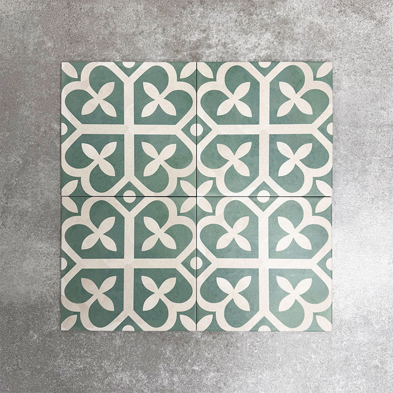 Ivy Green Victorian Moroccan style 20x20cm patterned tiles, shown as four tiles together to highlight the repeating green and white geometric pattern.