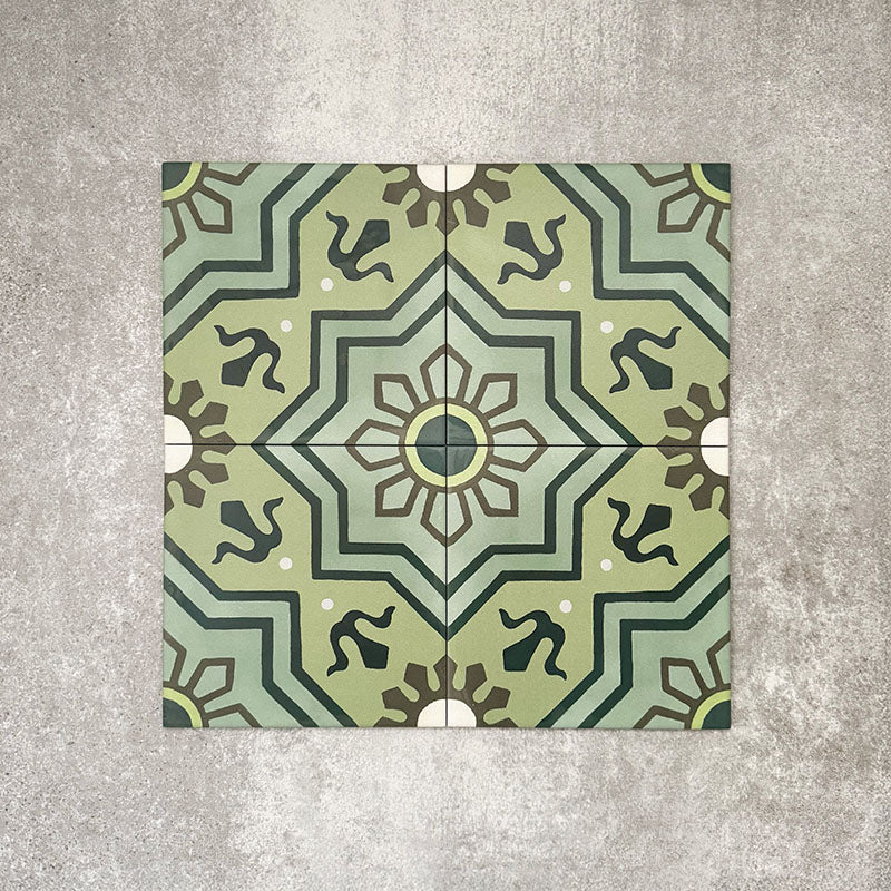 Patterned layout of Balthazar Verde 20×20cm Moroccan-style porcelain tiles, showing the full encaustic-inspired geometric design in layered green tones with dark accents, ideal for creating bold feature floors or statement walls.
