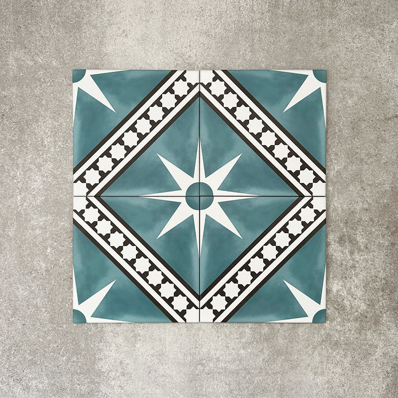 Gilgamesh Blue Moroccan style 20x20cm patterned tiles, shown as a flat lay to highlight the repeating blue, black and white geometric star pattern.