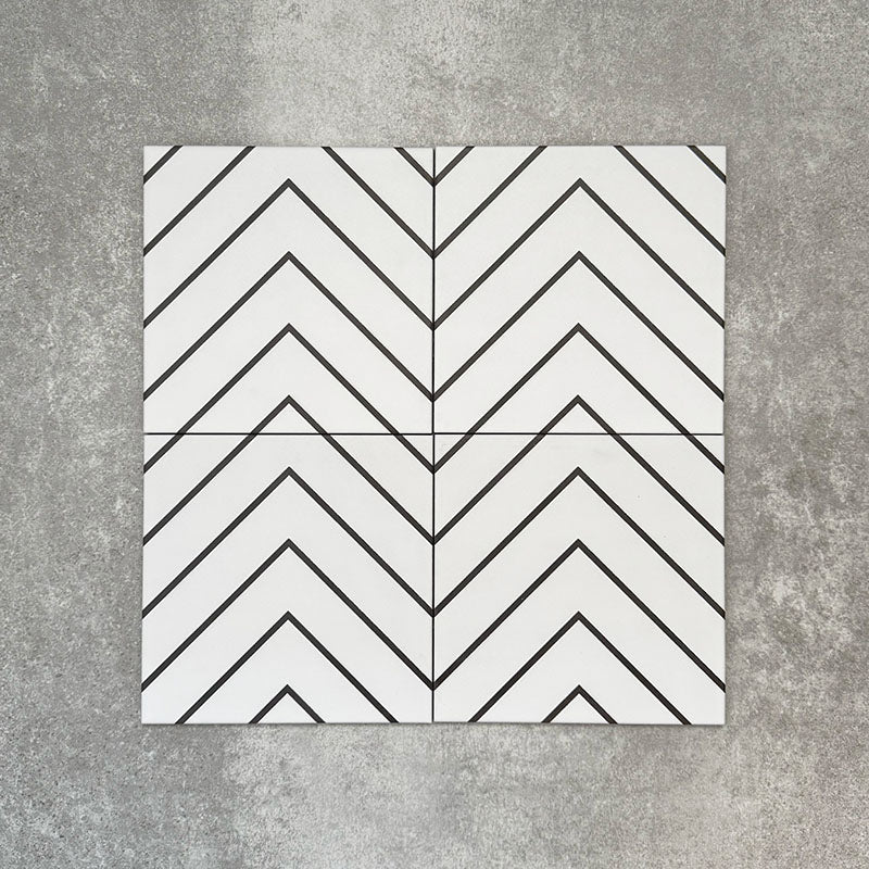 Four Almeria Jilani White Moroccan-style porcelain wall and floor tiles displayed together in a clean black line chevron pattern on a white base, 20x20cm.