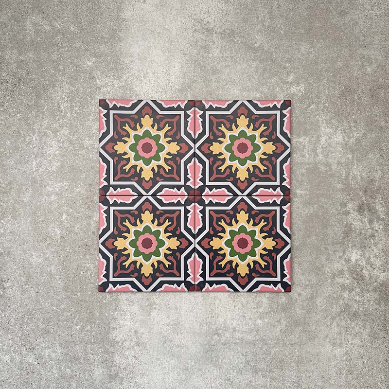 Cuba Havana Mini Moroccan-style porcelain tiles in a 15×15cm square format, arranged in a repeating geometric pattern with navy backgrounds and pink, green and mustard detailing, showcasing the tile’s intricate encaustic-style motifs and bold decorative symmetry.
