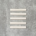 Zellige Oyster bullnose ceramic tiles in a soft oyster white finish, 3 × 20 cm, shown laid flat on a neutral background.
