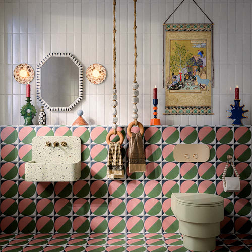 Bathroom featuring Abstract Moon 20x20cm patterned tiles in soft pink and green tones, styled with eclectic décor, statement accessories, and contemporary sanitaryware for a bold playful interior design.