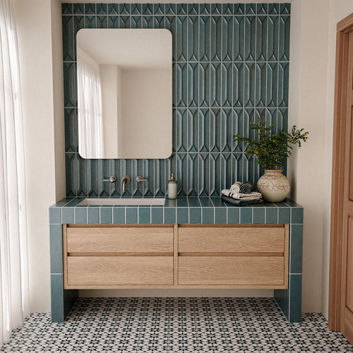 Bathroom featuring Agadir Azul Blue 20cm x 20cm Moroccan-style floor tiles, with a black and white geometric pattern, paired with blue wall tiles, a wooden vanity and neutral décor.