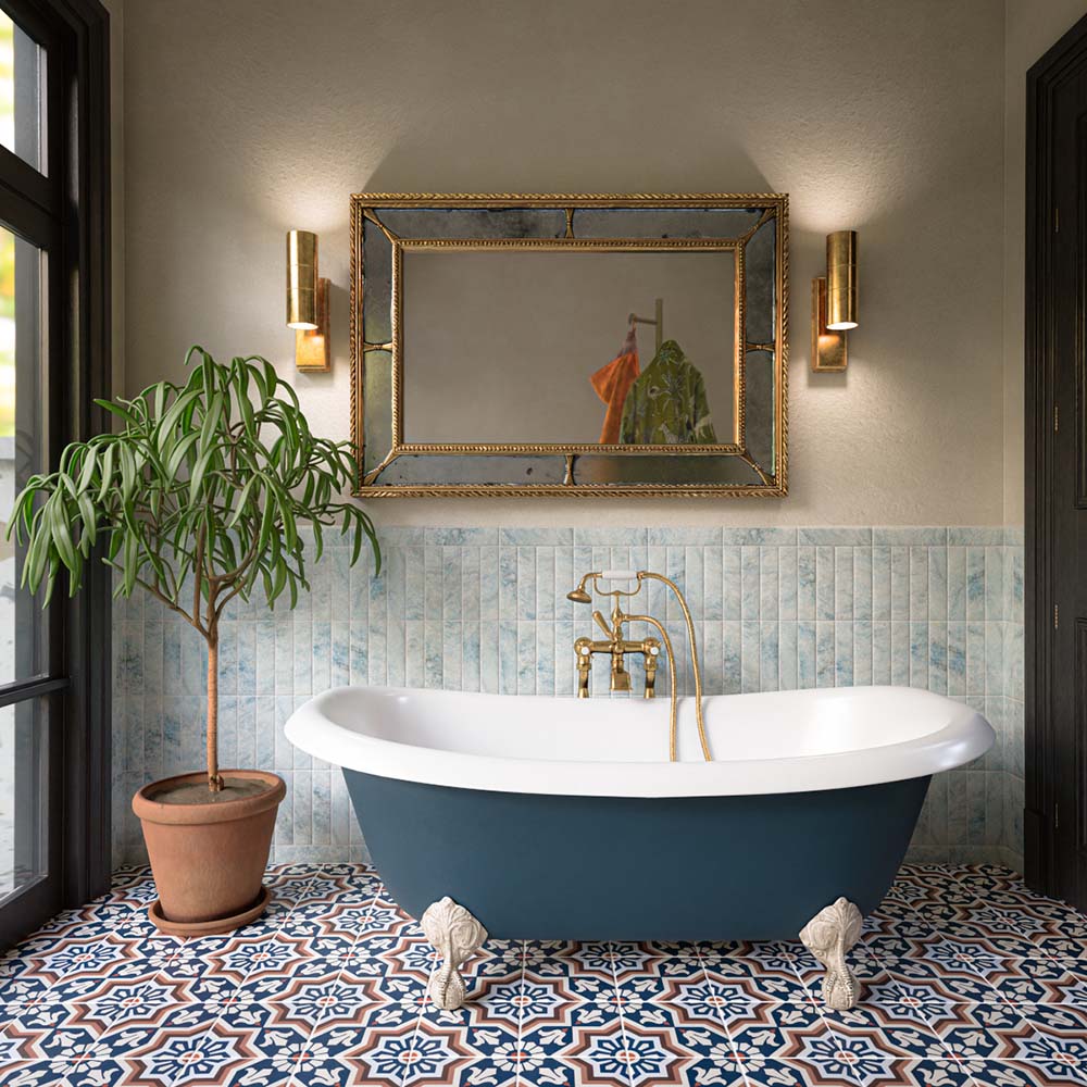 Bathroom featuring Amalfi Brick Azul Vintage Marble 5.4x22cm wall tiles with soft blue marble tones and natural variation, paired with a freestanding bath, brass fixtures and patterned Victorian Moroccan-style floor tiles for an elegant, characterful interior.