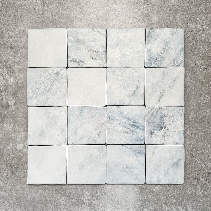 Product image of Amalfi Square Azul Vintage Marble wall and floor tiles in an 11cm x 11cm format, featuring soft blue and white marble effect detailing, subtle veining and gently rounded vintage-inspired edges.