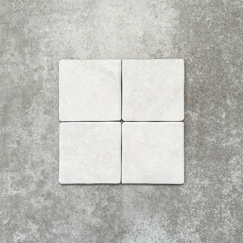 Product image of Amalfi Square Carrara Vintage Marble wall and floor tiles in an 11cm x 11cm format, featuring a soft white marble effect surface with subtle tonal variation and gently rounded edges.