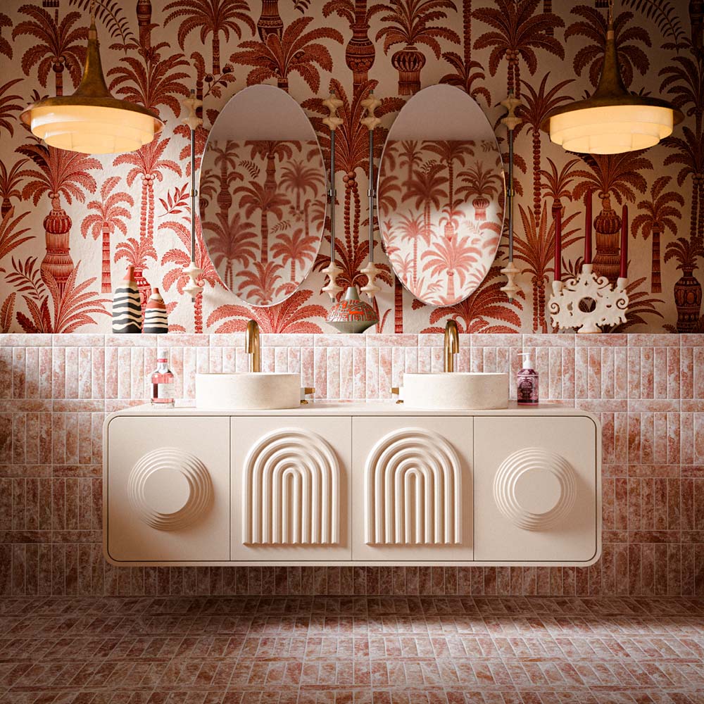 Luxury bathroom featuring Amalfi Brick Rouge Vintage Marble wall and floor tiles in a 5.4cm x 22cm format, paired with blush pink tones, decorative palm wallpaper, twin basins and warm brass accents.