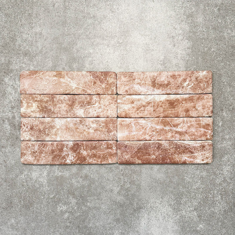 Product image of Amalfi Brick Rouge Vintage Marble wall and floor tiles in a 5.4cm x 22cm format, showcasing warm blush pink marble effect detailing and natural tonal variation.