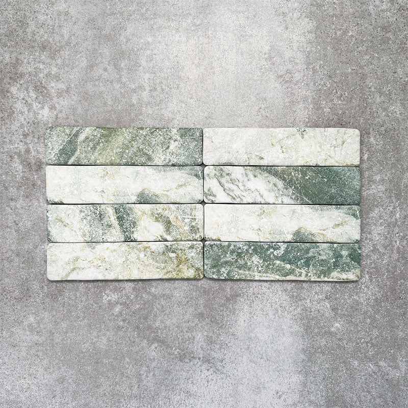 Product image of Amalfi Brick Salvia Vintage Marble wall and floor tiles in a 5.4cm x 22cm format, showcasing green and white marble effect detailing with natural veining and tonal variation.