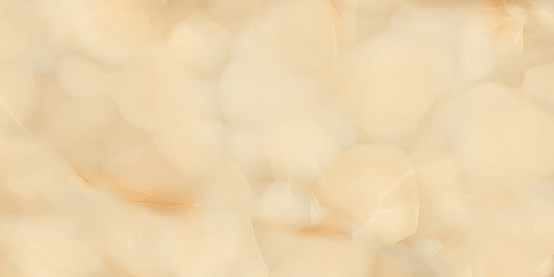 Close-up of Anastasia Miele Onyx Polished 60 × 120cm stone effect tile, featuring warm honey and cream tones with flowing gold and amber veining, creating a rich, layered pattern with a high-gloss polished finish.