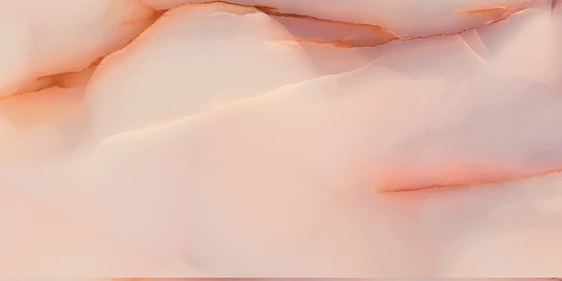 Close-up of Anastasia Rose Onyx Polished 60 × 120cm stone effect tile, featuring soft pink tones with flowing gold veining, creating a gentle, layered pattern with a high-gloss polished finish.