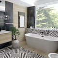 Bathroom interior featuring Art Deco Black & White marble effect patterned porcelain tiles 44 × 44cm, used across the floor and bath panel to create a bold, continuous geometric layout. The contrasting black and white tones introduce strong structure and rhythm, balanced with wood-effect wall panels, a freestanding bath, and matte black fittings for a clean, modern finish.