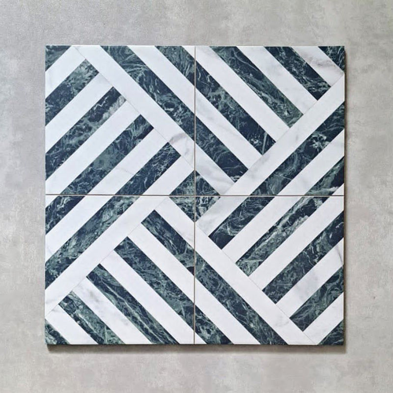 Flat lay of Art Deco Emerald Green marble effect patterned porcelain tiles 44 × 44cm, arranged to showcase the repeating geometric design. The combination of deep emerald marble effect lines and crisp white segments creates a structured, interlocking pattern with strong visual movement and contrast.