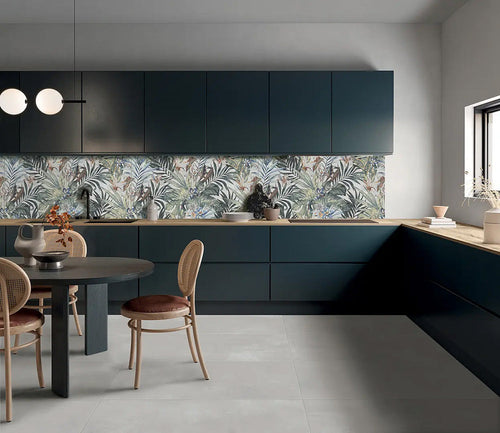 Kitchen featuring Bahamas 60 × 120cm wall and floor tiles, used as a striking tropical-style splashback with layered botanical detail. Paired with deep cabinetry and wood worktops for a balanced, design-led finish.