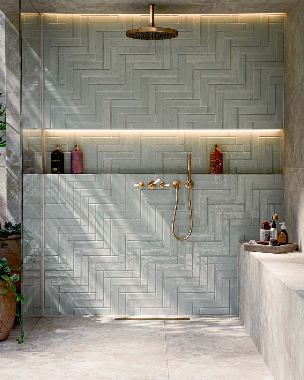 Bathroom featuring Baresi Cream 3D Terrazzo Effect 60x120cm porcelain tiles, showcasing a warm cream terrazzo effect design with subtle texture, paired with sage green feature wall tiles, brass fittings and a contemporary walk-in shower.