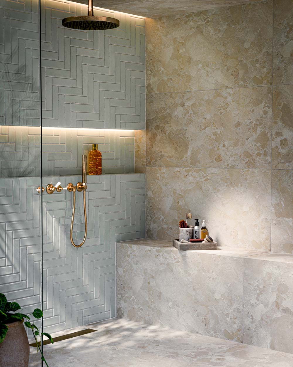 Bathroom featuring Baresi Cream 3D Terrazzo Effect 60x120cm porcelain tiles, showcasing a warm cream terrazzo effect design with subtle texture, paired with sage green feature wall tiles, brass fittings and a contemporary walk-in shower.