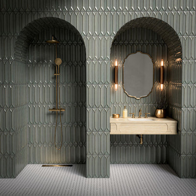 Bathroom vanity area featuring Baroque Decor Lichen Green 9.1x37.5cm porcelain wall tiles, showcasing a glossy fluted design in soft green tones, paired with a stone basin, brass fittings and warm ambient lighting.