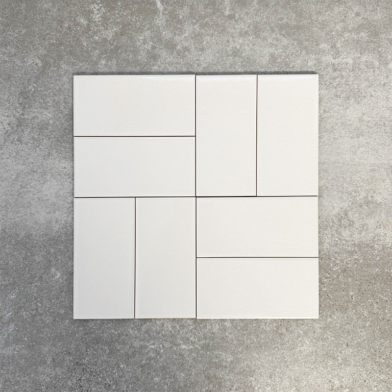 Pimlico White 7.5 × 15cm ceramic wall tiles with a crackle glaze finish, shown in a basketweave layout that highlights soft white tones, subtle texture and versatile design options for kitchens and bathrooms.