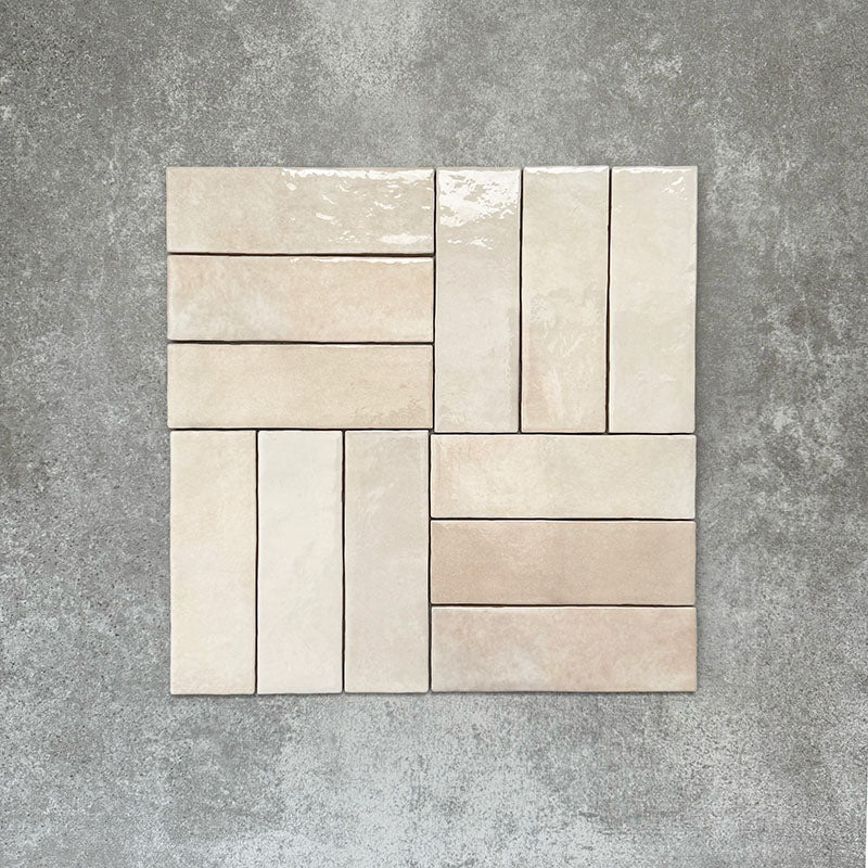 Zellige Bone Moroccan-style brick tiles in a warm beige tone, shown in a simple basketweave layout.