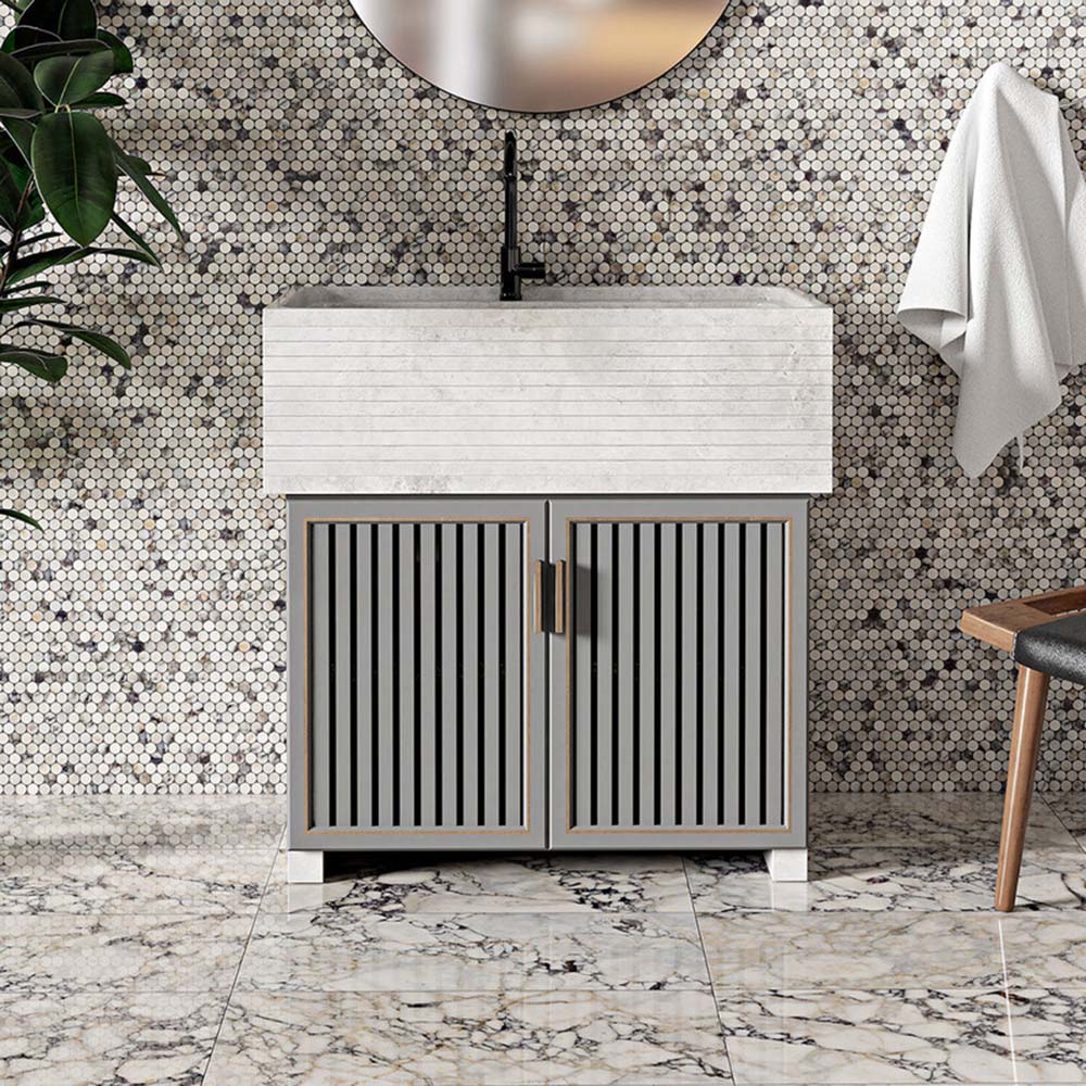 Bathroom interior featuring Fayrouz Picasso 30.5x61cm natural marble tiles with a honed finish, installed on the floor to showcase a white base with bold grey, green and warm gold veining, creating a statement surface with rich natural movement and variation.