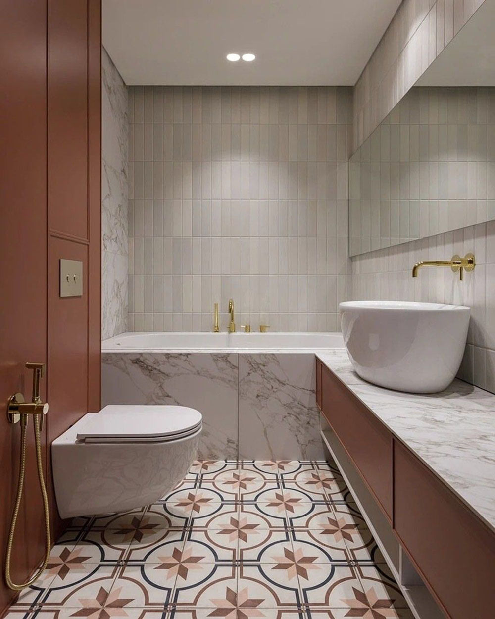 Bathroom setting featuring Viscount Rose 20x20cm Victorian style wall and floor tiles, showcasing a decorative geometric pattern in soft rose and neutral tones, paired with marble surfaces and brass fittings for a refined, timeless finish.