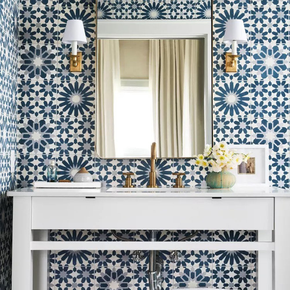 Bathroom featuring Souk Blue A 20×20cm Moroccan-style porcelain wall tiles in a blue, white and grey geometric pattern.