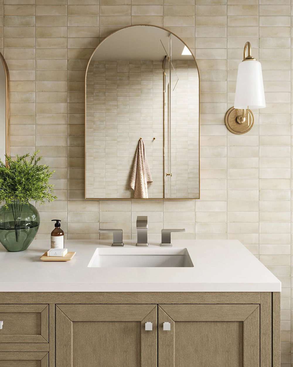 Bathroom setting featuring Benomar Canvas Moroccan style mini brick tiles in a 5x15cm format, finished in a soft matt surface. Laid in a horizontal brick pattern, the subtle tonal variation and handcrafted look create a gentle sense of texture across the wall.
