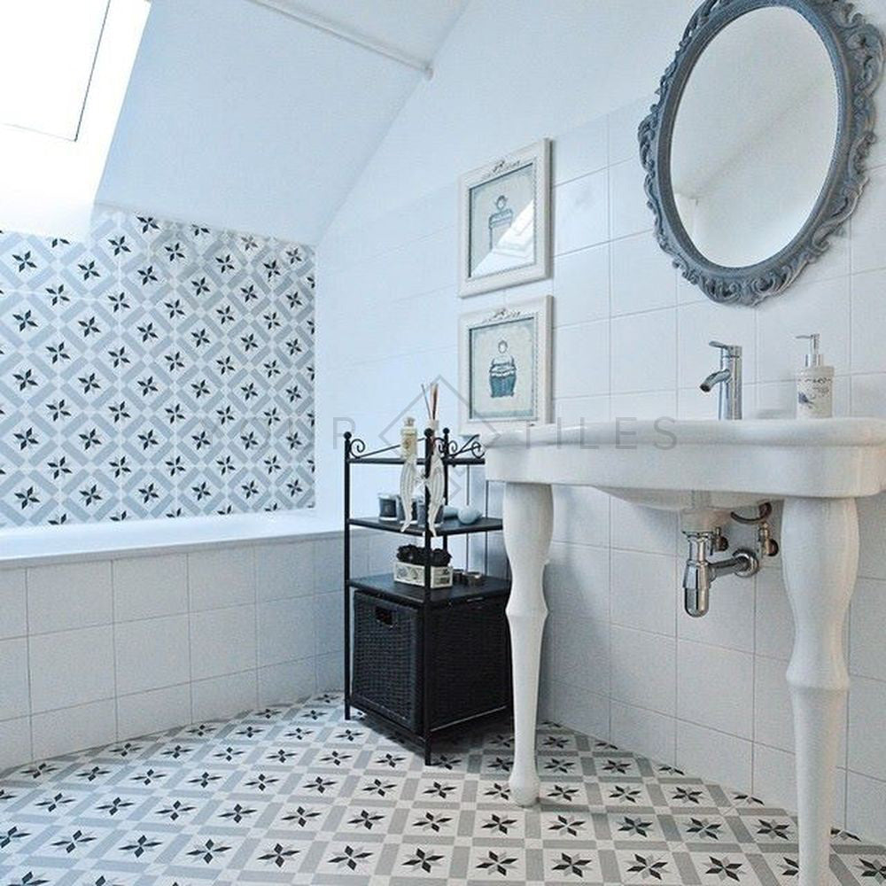 Bathroom featuring Canterbury Star Victorian-style porcelain floor and wall tiles in a 20 × 20cm format, laid in a repeating star pattern and paired with classic white sanitaryware, decorative mirrors and soft neutral tones for a timeless Victorian-inspired bathroom design.