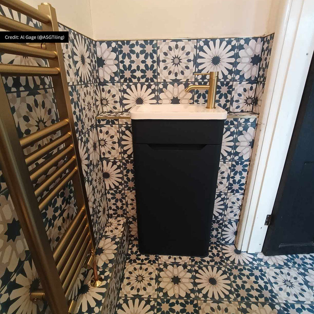 Bathroom featuring Souk Blue A 20×20cm Moroccan-style porcelain tiles in a blue, white and grey geometric pattern.