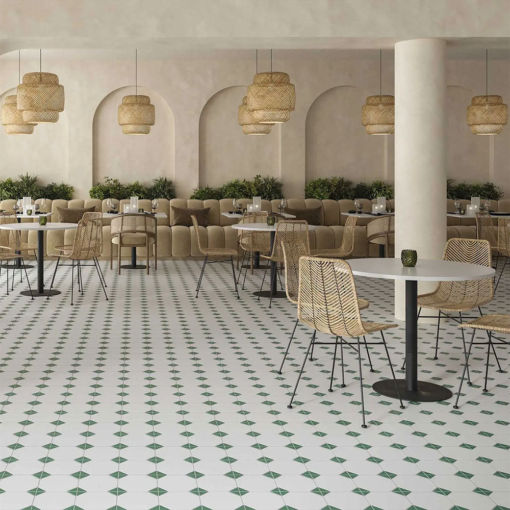Restaurant interior featuring Belvoir Green 33 × 33cm Victorian style porcelain floor tiles, creating a classic geometric pattern with soft green and white tones. Paired with natural textures and warm lighting for an inviting, timeless setting.