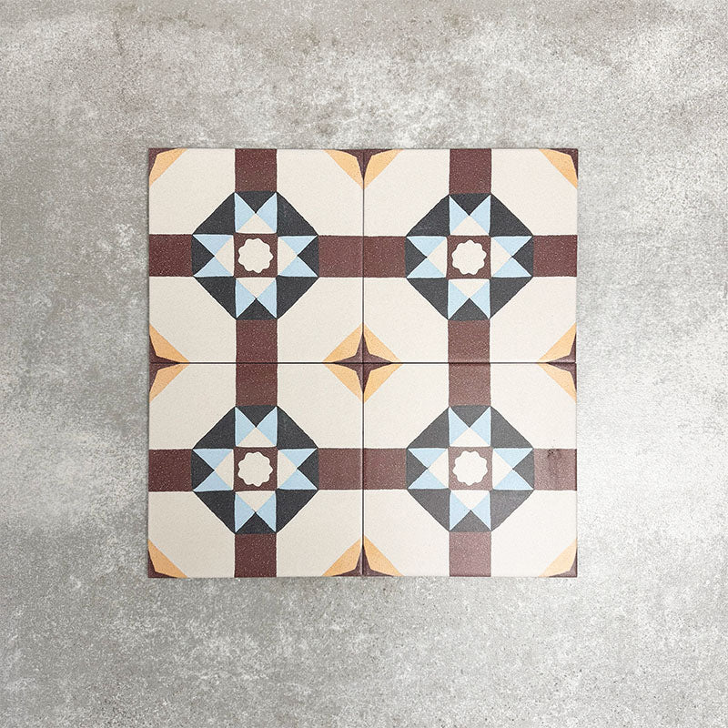Four London Streets Berlin Street 20x20cm Victorian Moroccan style porcelain tiles arranged together to showcase the repeating geometric star pattern in burgundy, soft blue and cream tones inspired by traditional Victorian style decorative floor tiles.