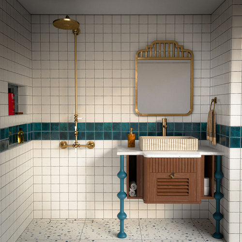 Bathroom featuring Bora Bora White Sand Square wall tiles in a 10cm x 10cm format with a flux glaze finish, paired with a teal feature border, brass shower fittings, terrazzo effect flooring and a floating timber vanity.