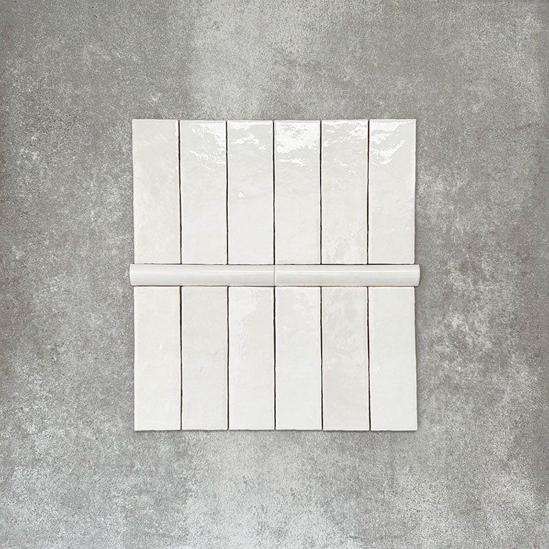 Zellige White Moroccan-style ceramic brick tiles with matching 3 × 20cm bullnose trim, shown in a clean, glossy white finish.