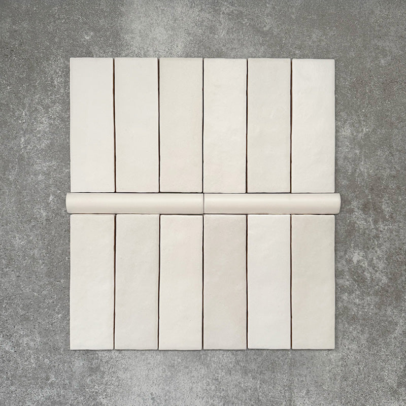 Zellige Chalk White Moroccan-style brick tiles with matching 3 × 20cm bullnose trim in a soft ceramic finish.