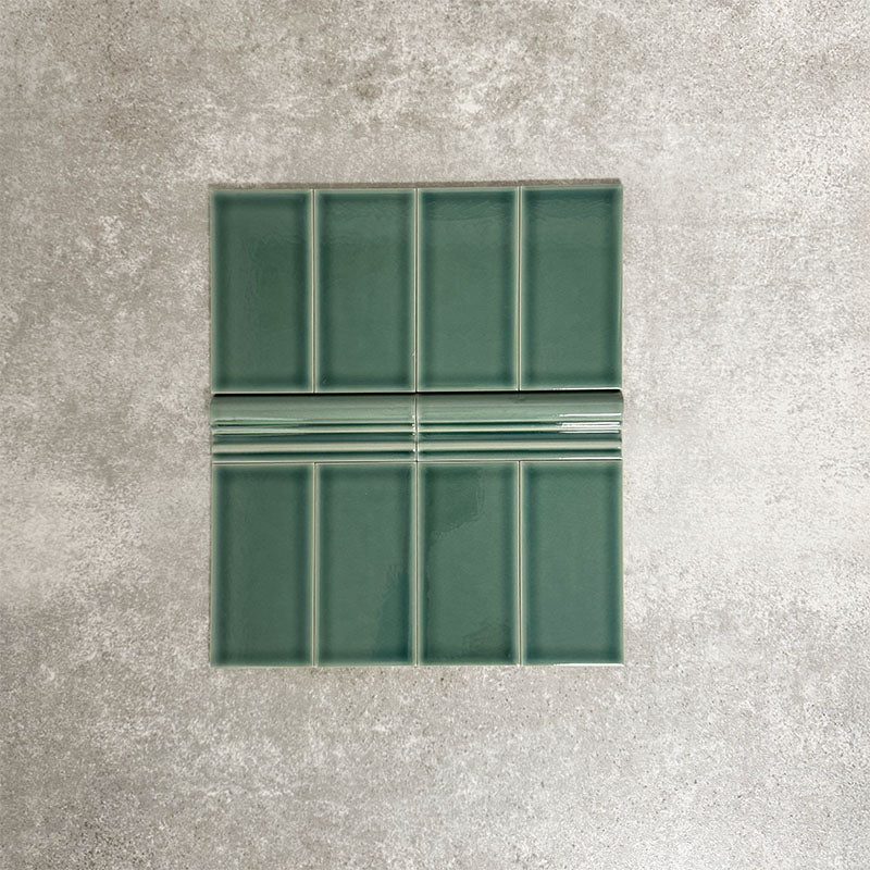 Pimlico Golders Green 7.5 × 15cm ceramic wall tiles with a crackle glaze finish, combined with matching 5 × 15cm dado trim to create a decorative horizontal feature with classic, period-style detail.