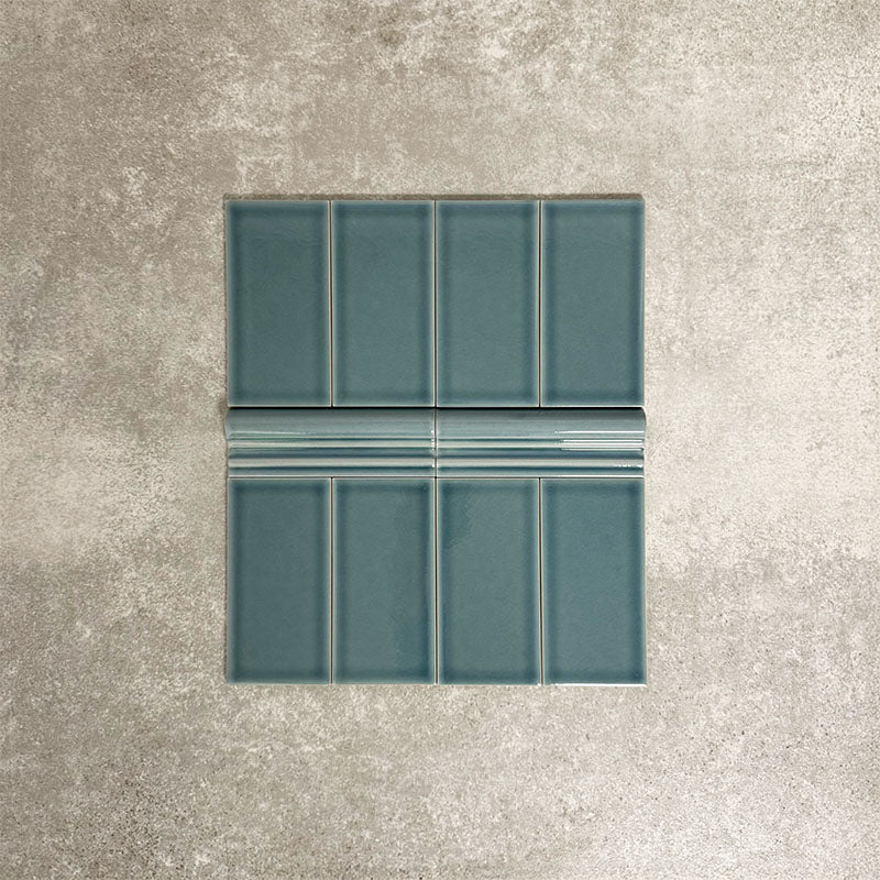 Pimlico River Blue 7.5 × 15cm ceramic wall tiles with a crackle glaze finish, combined with matching 5 × 15cm dado trim to create a decorative horizontal feature that adds depth and classic detail to wall designs.
