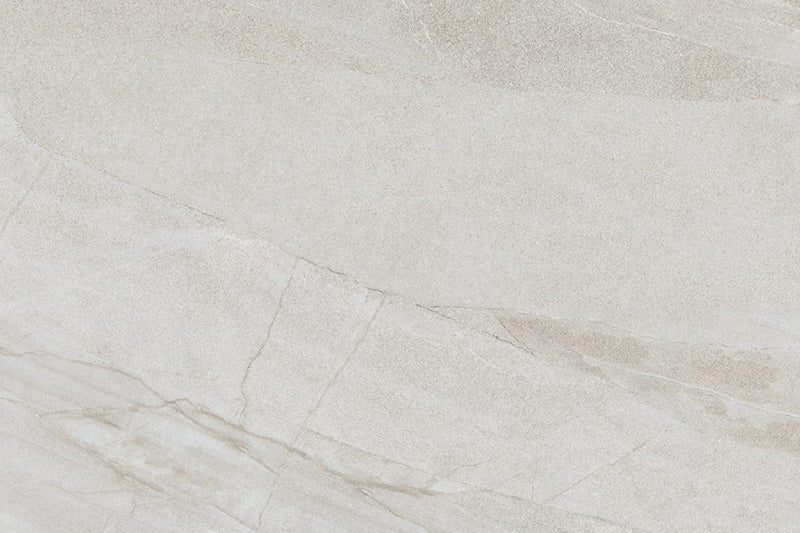 Comet Light Stone 2cm 60 × 90cm porcelain tile featuring a soft beige stone effect with subtle veining and natural tonal variation. Designed for outdoor use, offering a clean, calm finish for contemporary exterior spaces.