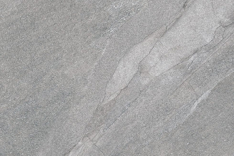 Flat lay of Comet Silver Stone 2cm 60 × 90cm porcelain tile, highlighting cool silver-grey stone effect tones with soft, natural veining and fine surface texture. Subtle variation creates a refined, contemporary finish suitable for both indoor and outdoor spaces.