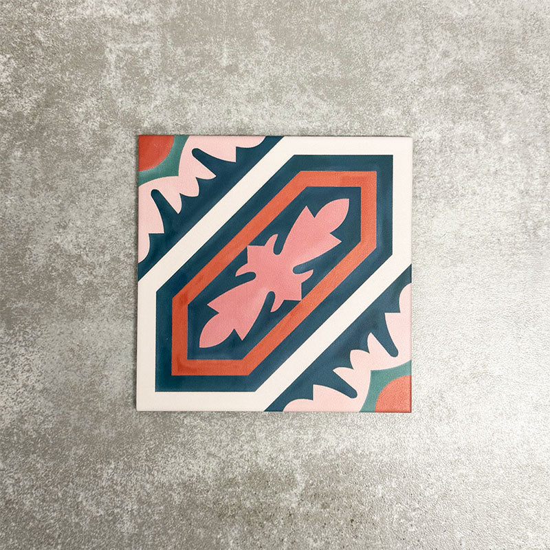 Single London Streets Conduit Street 20x20cm Victorian Moroccan style porcelain tile displayed in a product setting, featuring a bold geometric pattern in pink, teal and terracotta tones inspired by traditional decorative Victorian floor tiles.