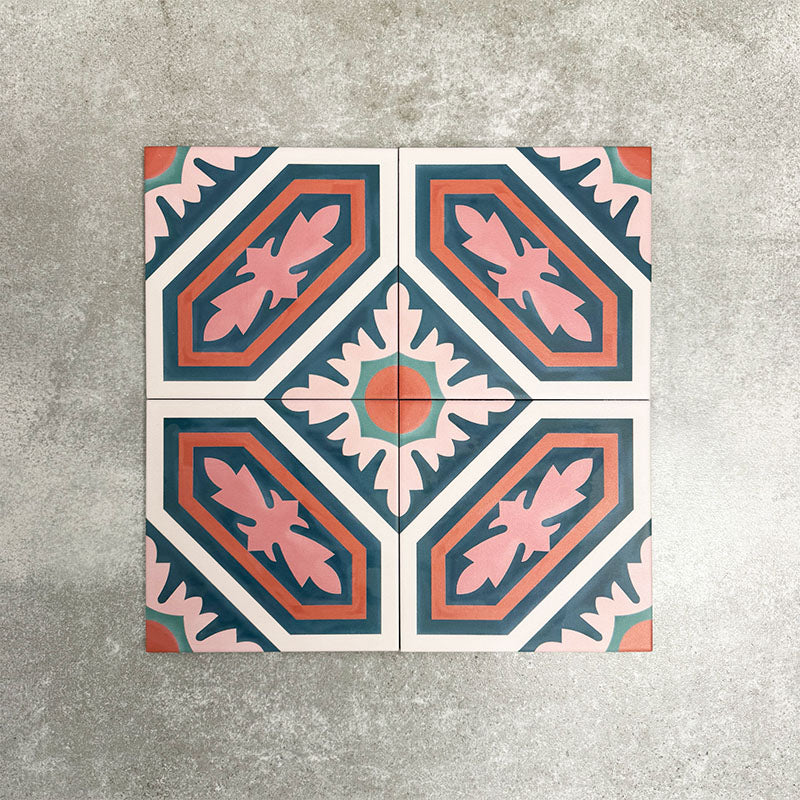 Four London Streets Conduit Street 20x20cm Victorian Moroccan style porcelain tiles arranged together to showcase the repeating pink, teal and terracotta geometric pattern inspired by traditional Victorian style decorative floor tiles.