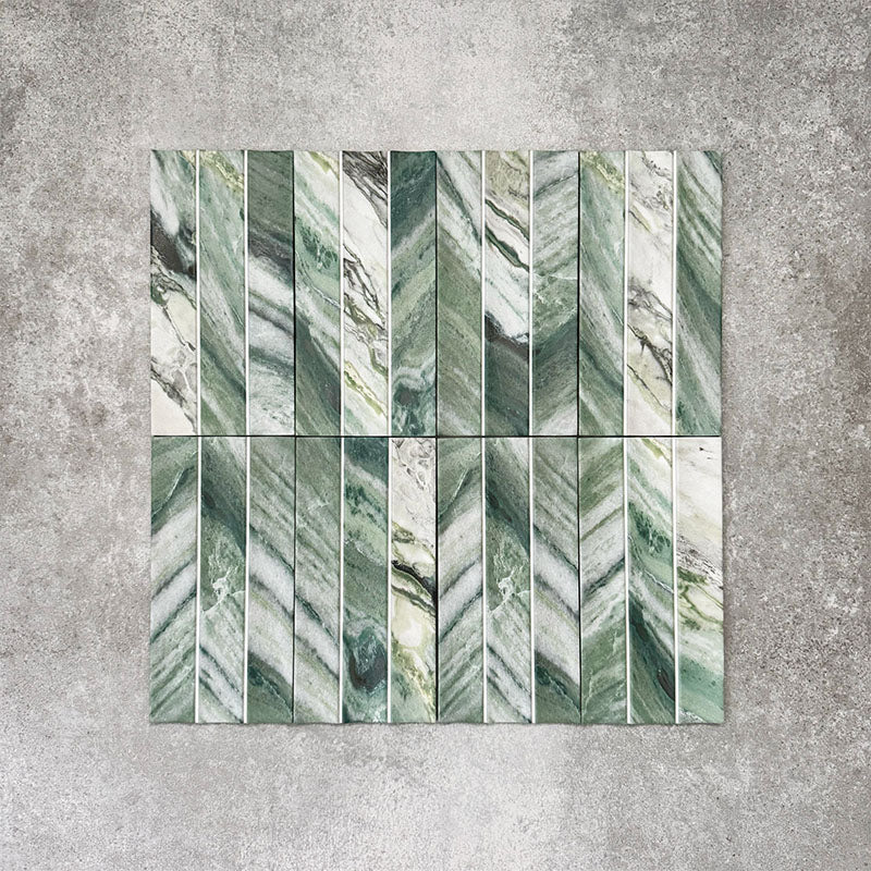 Product display of Crete Fluted Jade Matt 11.5x23cm wall tiles in green marble-effect tones, featuring fluted detailing with layered natural veining against a textured concrete-style backdrop.
