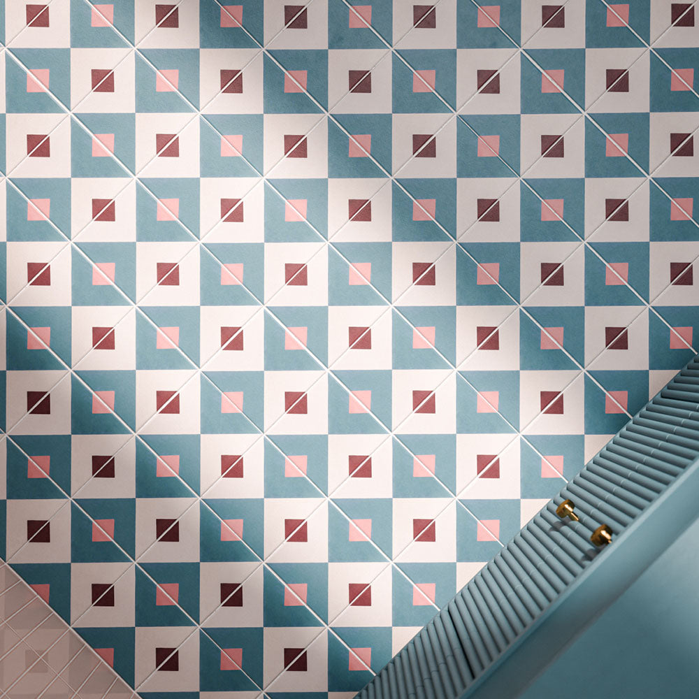 Cuba Guazzatto 20cm x 20cm Moroccan style patterned tiles, featuring a repeating geometric design in teal, white, soft pink and burgundy, creating a bold and playful bathroom floor.
