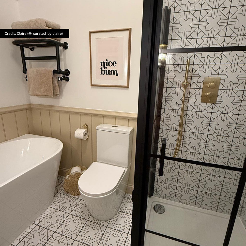 Bathroom featuring Almeria Palace Moroccan-style porcelain wall and floor tiles in a refined black and white geometric pattern, 20x20cm, paired with brass fixtures and neutral finishes.