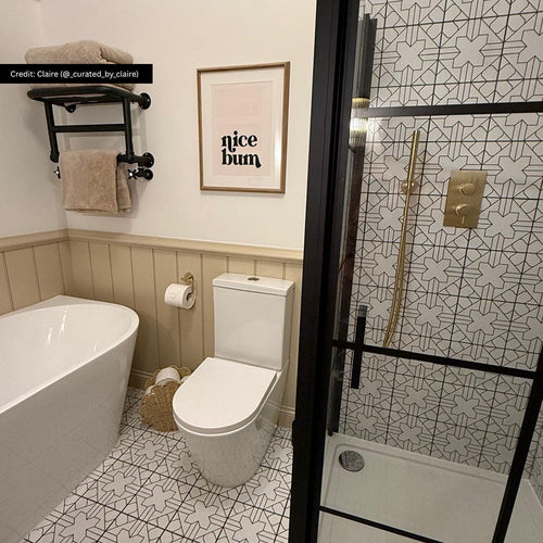 Bathroom featuring Almeria Palace Moroccan-style porcelain wall and floor tiles in a refined black and white geometric pattern, 20x20cm, paired with brass fixtures and neutral finishes.