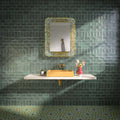 Bathroom featuring Dordogne Green Pines 7.5x15cm rustic gloss wall tiles, showcasing rich green tones with handmade-style shade variation, paired with a white floating vanity, mustard yellow basin, brass fittings, ornate mirror and patterned green floor tiles.