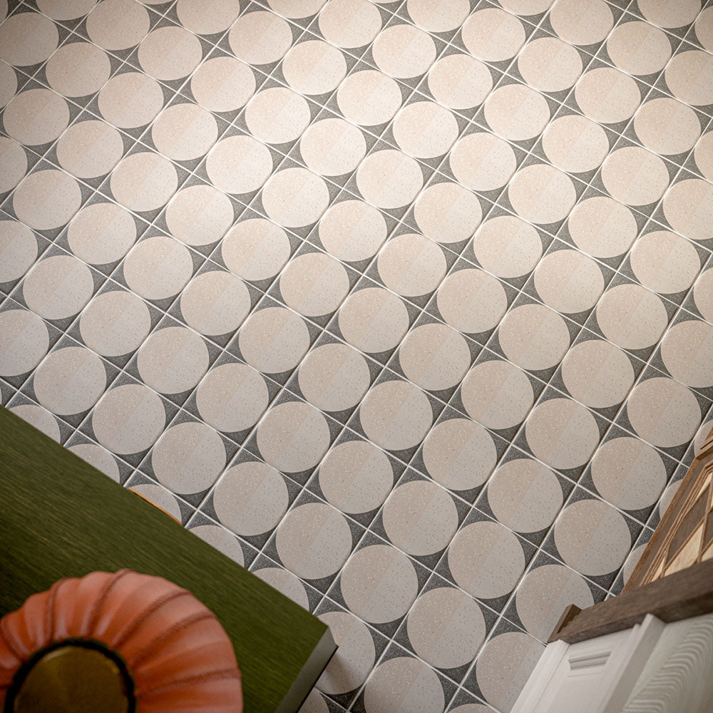 Hallway featuring Eclipse Lunar 20x20cm terrazzo-effect patterned floor tiles, styled with a statement green sideboard, colourful floral arrangement, decorative mirrors and elegant contemporary interiors with warm neutral tones.