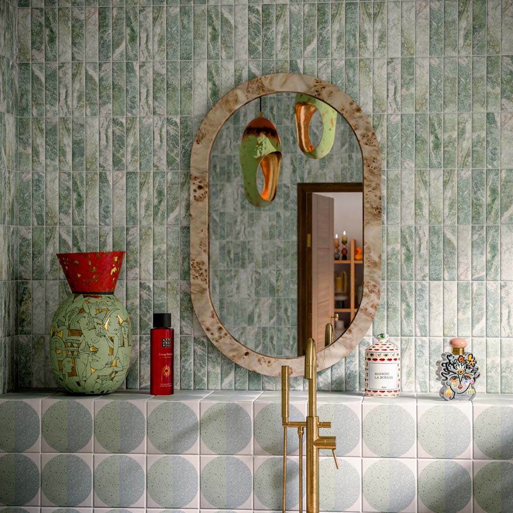 Bathroom featuring Eclipse Salvia 20x20cm terrazzo-effect patterned wall and floor tiles, styled with a freestanding stone bath, green marble-effect brick tiles, brushed brass fixtures and botanical-inspired contemporary décor.