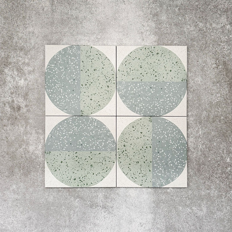Eclipse Salvia 20x20cm terrazzo-style decor tiles featuring a soft sage and pale blue circular pattern, designed to bring a playful yet calming geometric look to contemporary interiors.